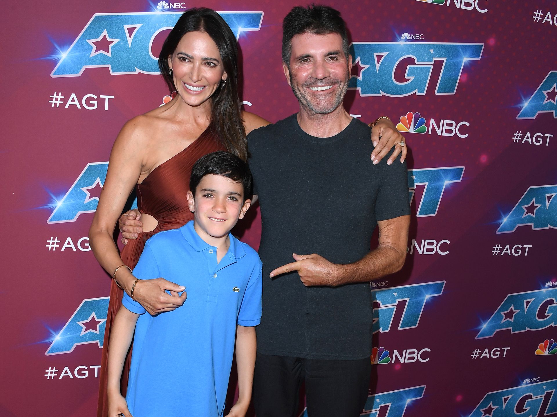 Simon Cowell's son Eric, 9, beams in rare appearance with parents - and he's just like his dad! | HELLO!