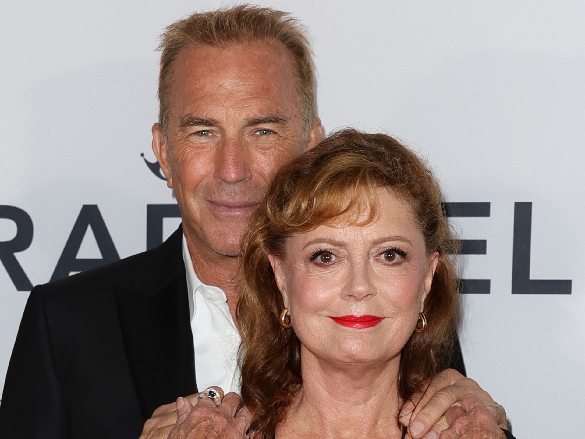 Susan Sarandon, 77, rocks plunging neckline as she hold hands with Kevin  Costner, 69 | HELLO!