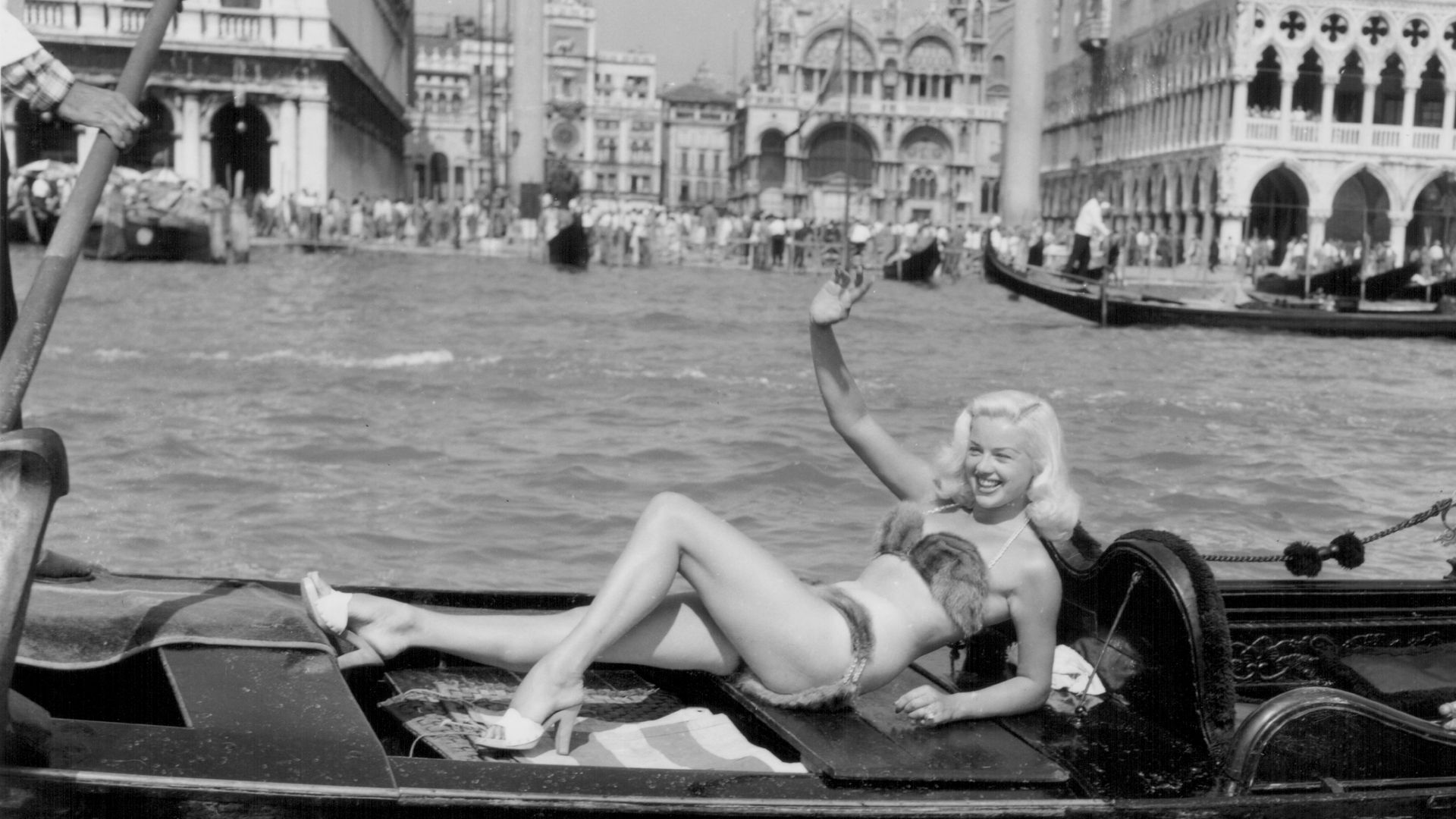 Diana Dors modeling a mink bikini on a gondola, venice film festival
