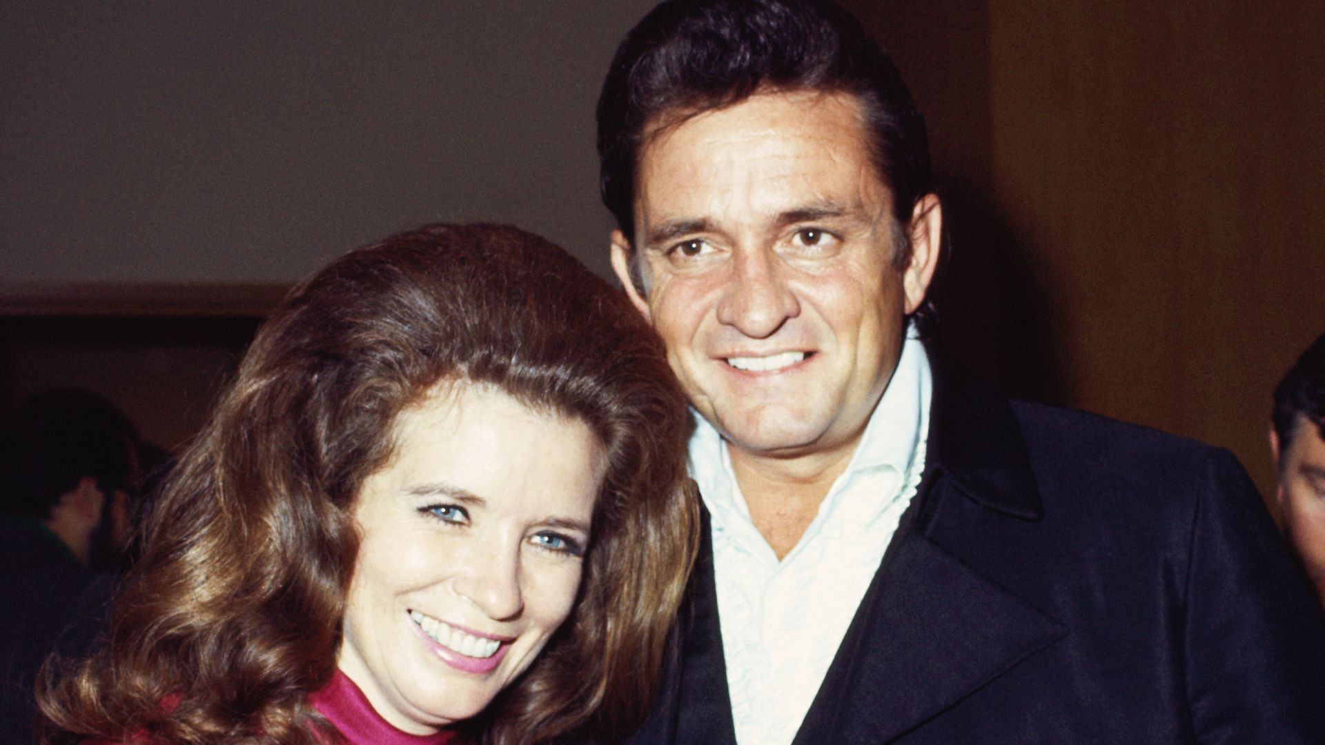johnny cash and june carter cash smiling in 1969