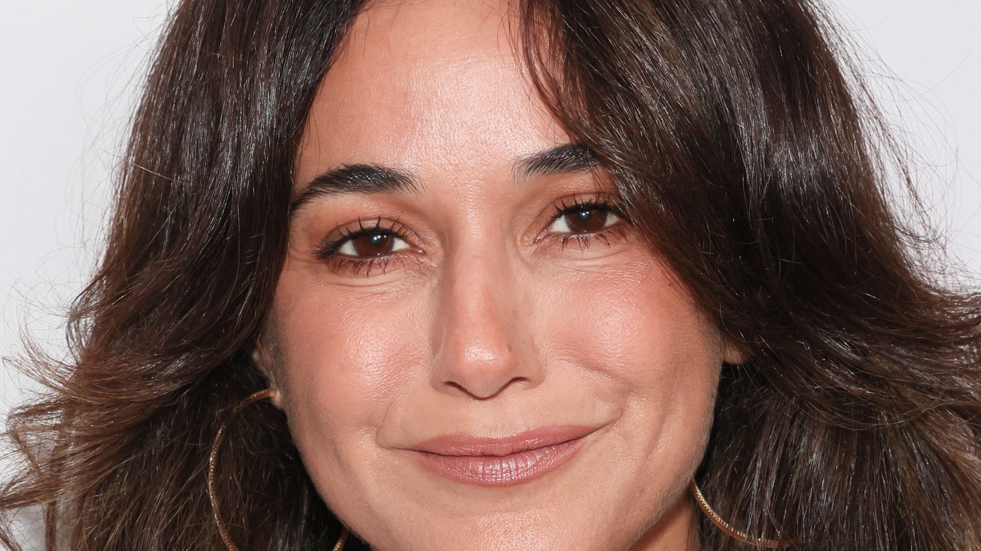 Emmanuelle Chriqui, 49, stuns in tiny red bikini on waterside vacation
