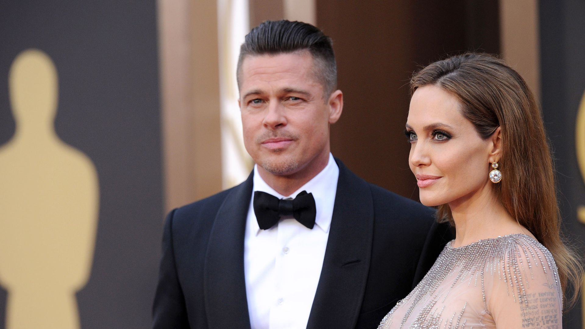 Brad Pitt and Angelina Jolie arrive at the 86th Annual Academy Awards at Hollywood & Highland Center on March 2, 2014 in Hollywood, California.