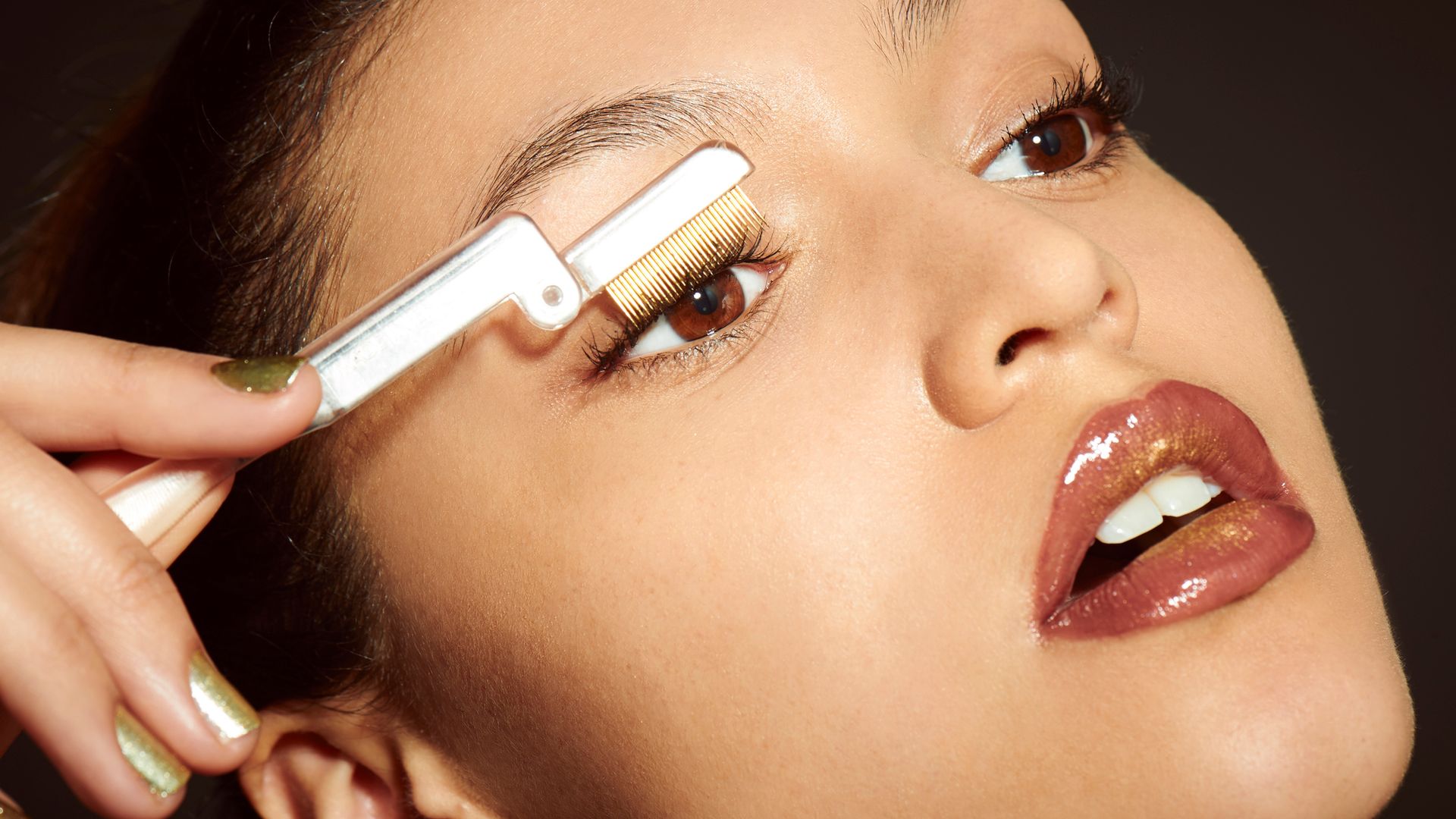 woman applying eyelash serum