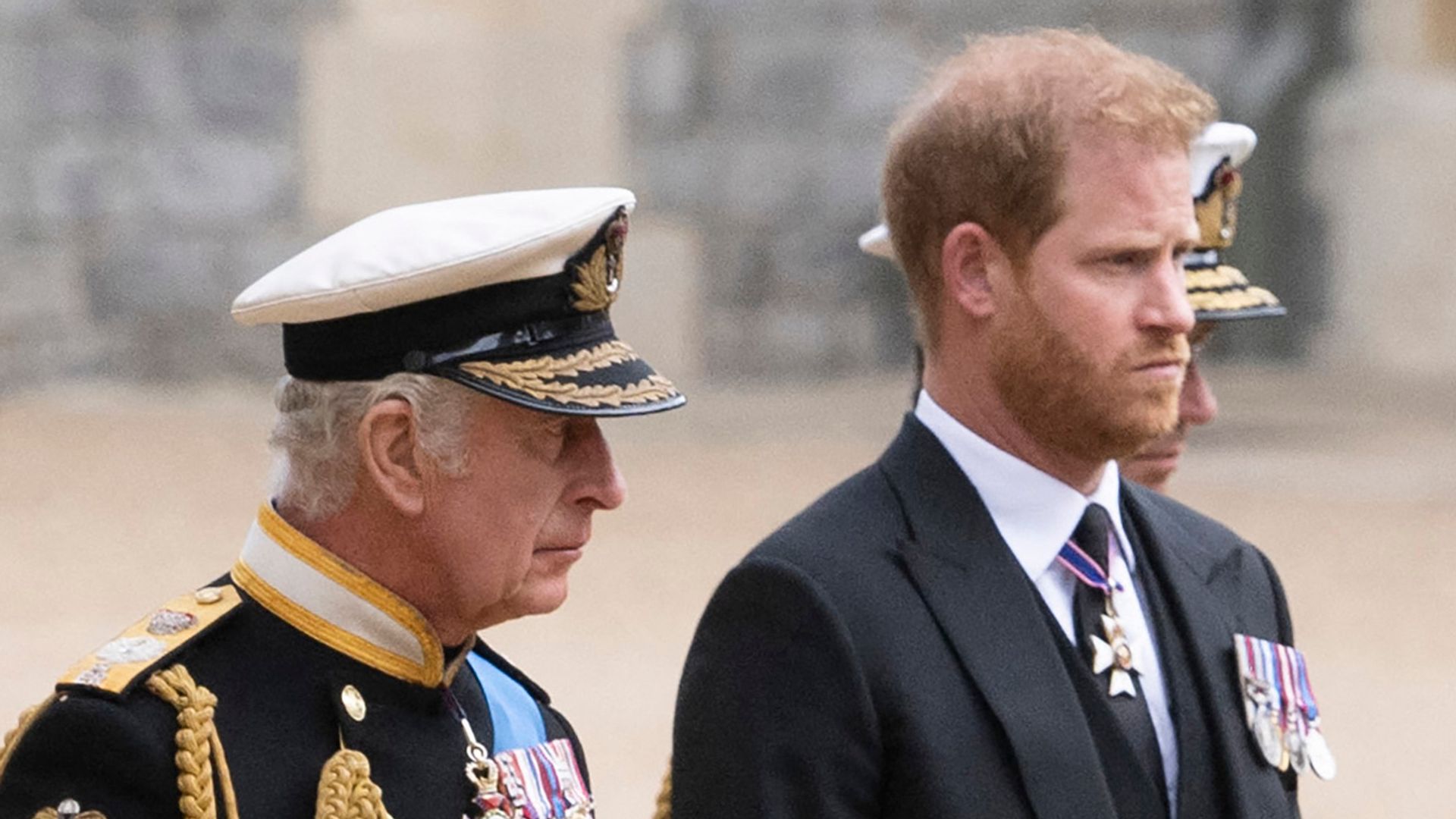 Britain's King Charles III (L) walks with his son Britain's Prince Harry, Duke of Sussex as they arrive at St George's Chapel inside Windsor Castle on September 19, 2022, ahead of the Committal Service for Britain's Queen Elizabeth II. Monday's committal service is expected to be attended by at least 800 people, most of whom will not have been at the earlier State Funeral at Westminster Abbey. (Photo by David Rose / POOL / AFP) (Photo by DAVID ROSE/POOL/AFP via Getty Images)
