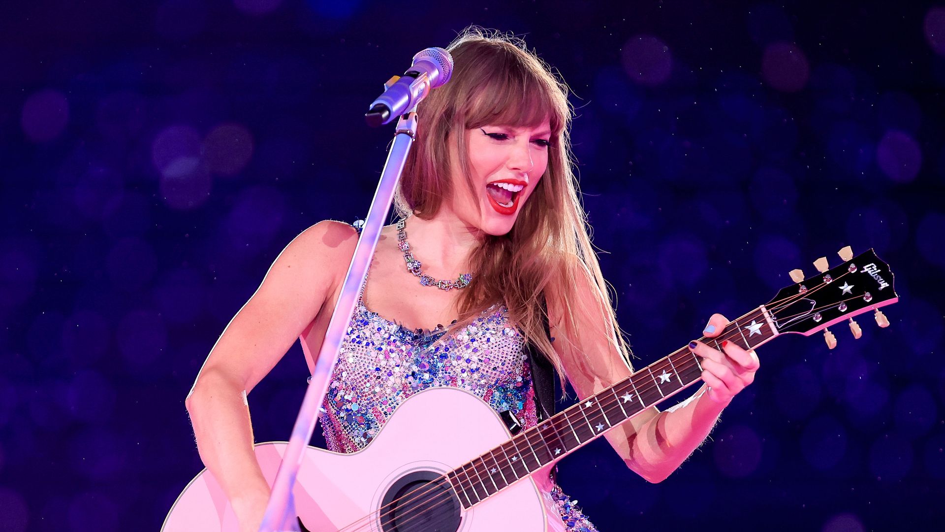 Taylor Swift rocks leg-baring mini amid record breaking