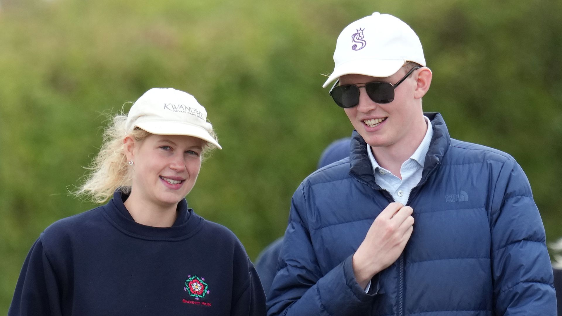 Lady Louise Windsor and Felix da-Silva Clamp smiling as they walk together