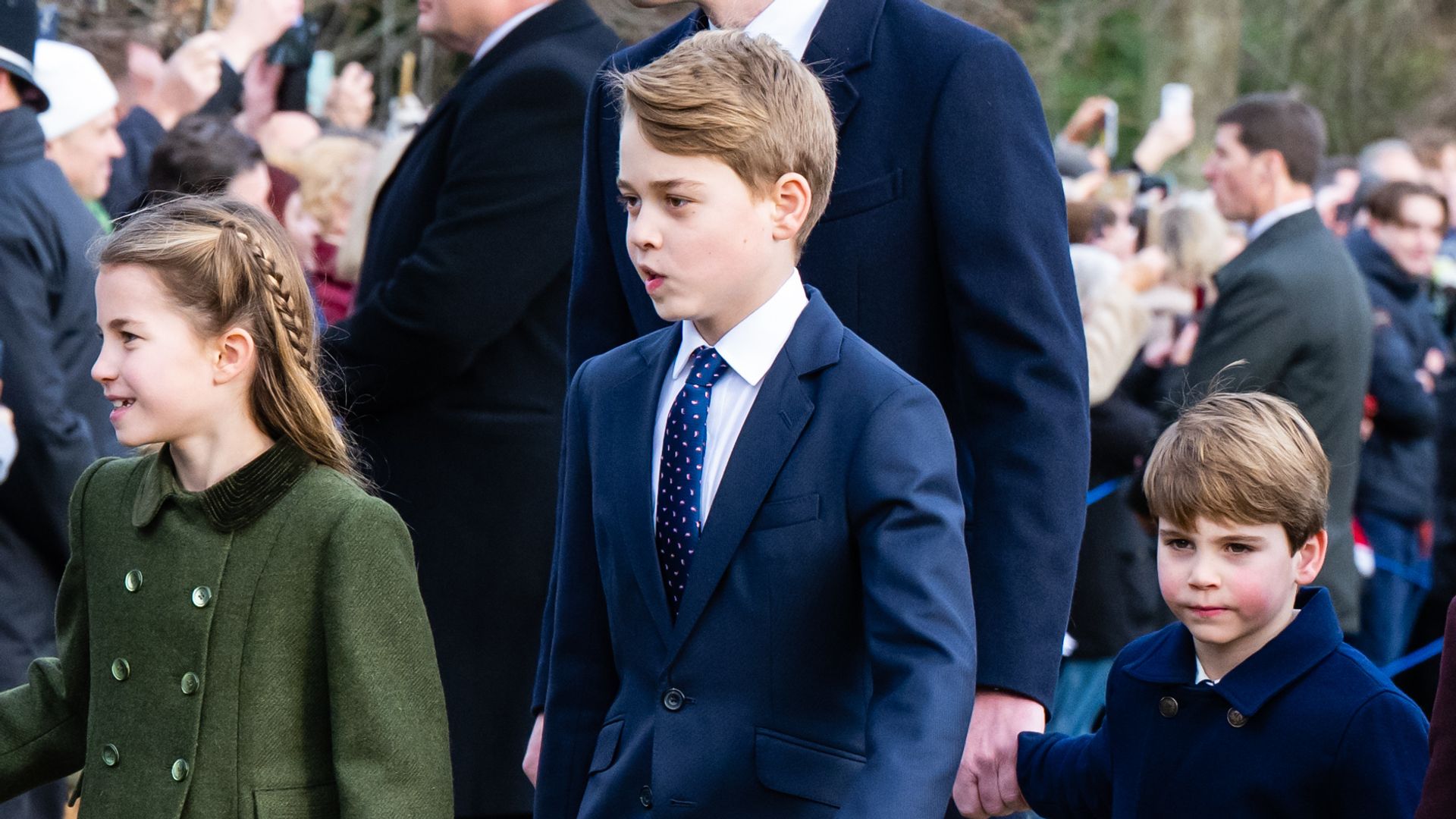 Catherine, Princess of Wales, Princess Charlotte of Wales, Prince George of Wales, Prince William, Prince of Wales, Prince Louis of Wales walking holding hands in coats