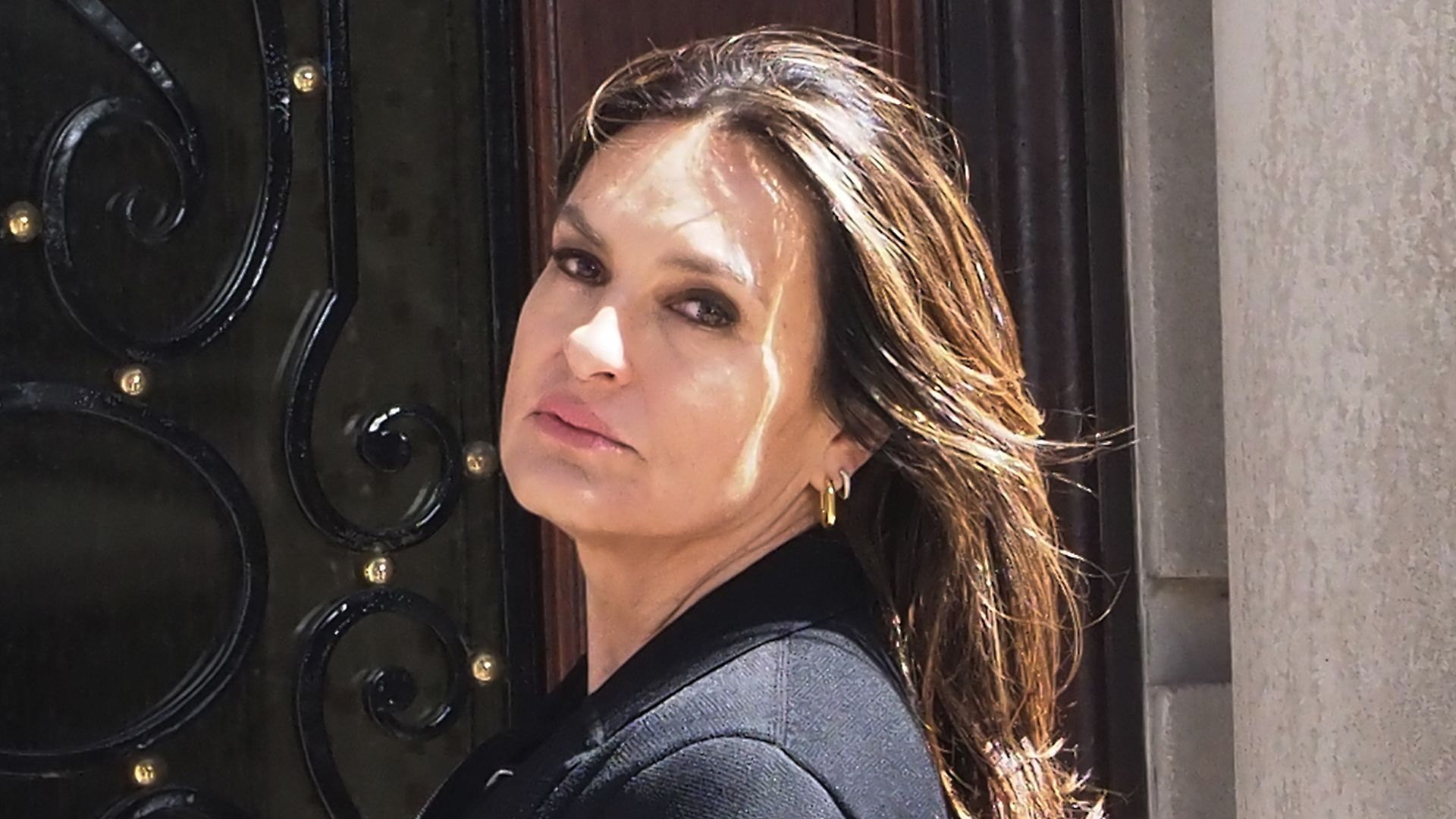 photo of mariska hargitay looking forlorn standing by door