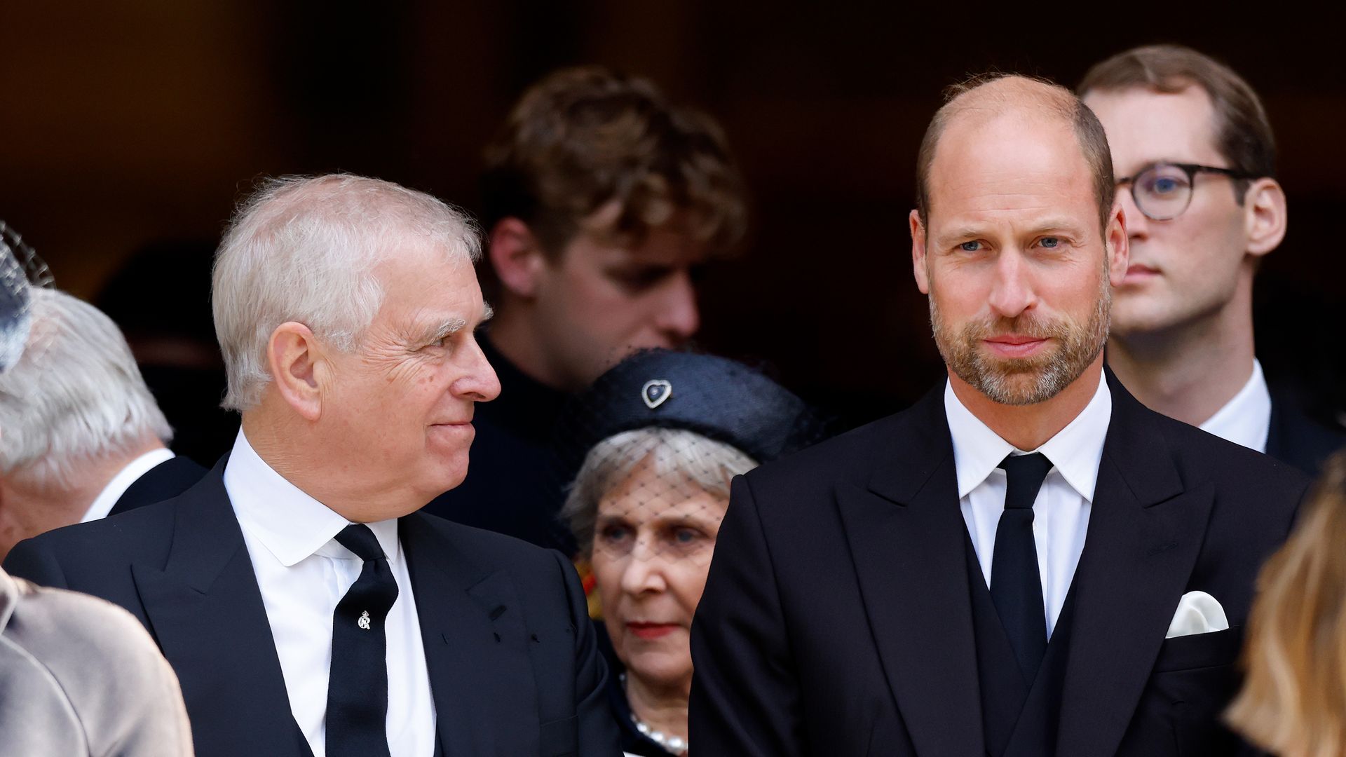 Andrew Mountbatten-Windsor looking at Prince William