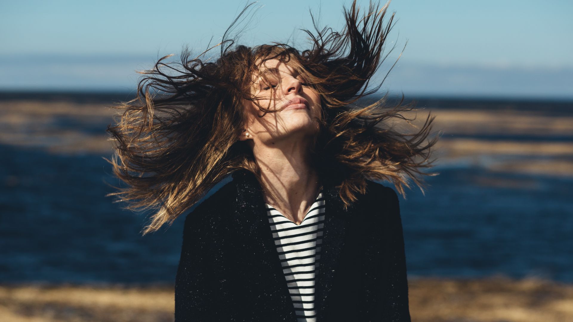 Woman with hair flying in the wind 