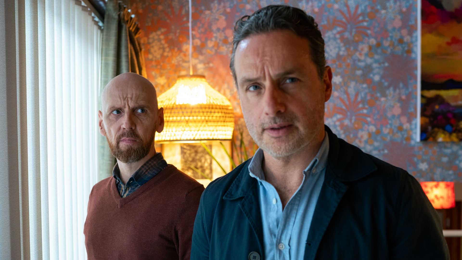 two men standing in living room