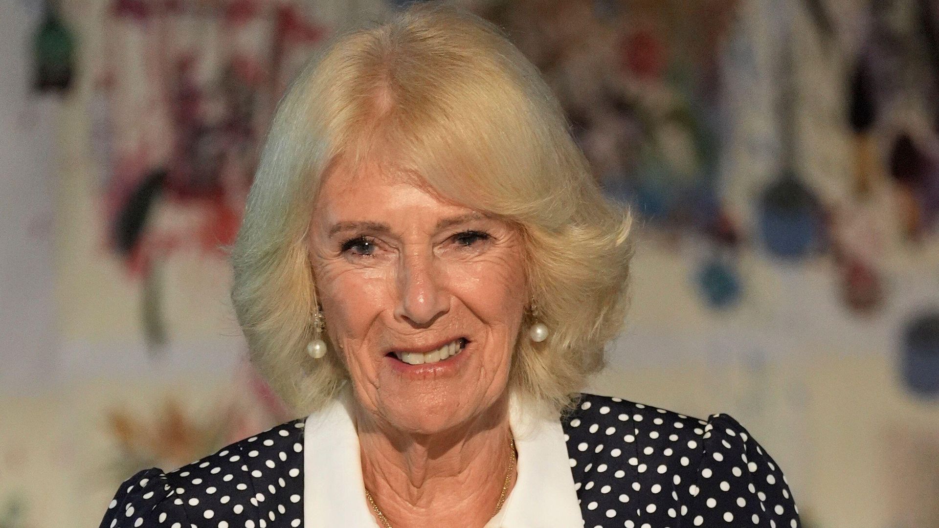 Queen Camilla in a spotted dress