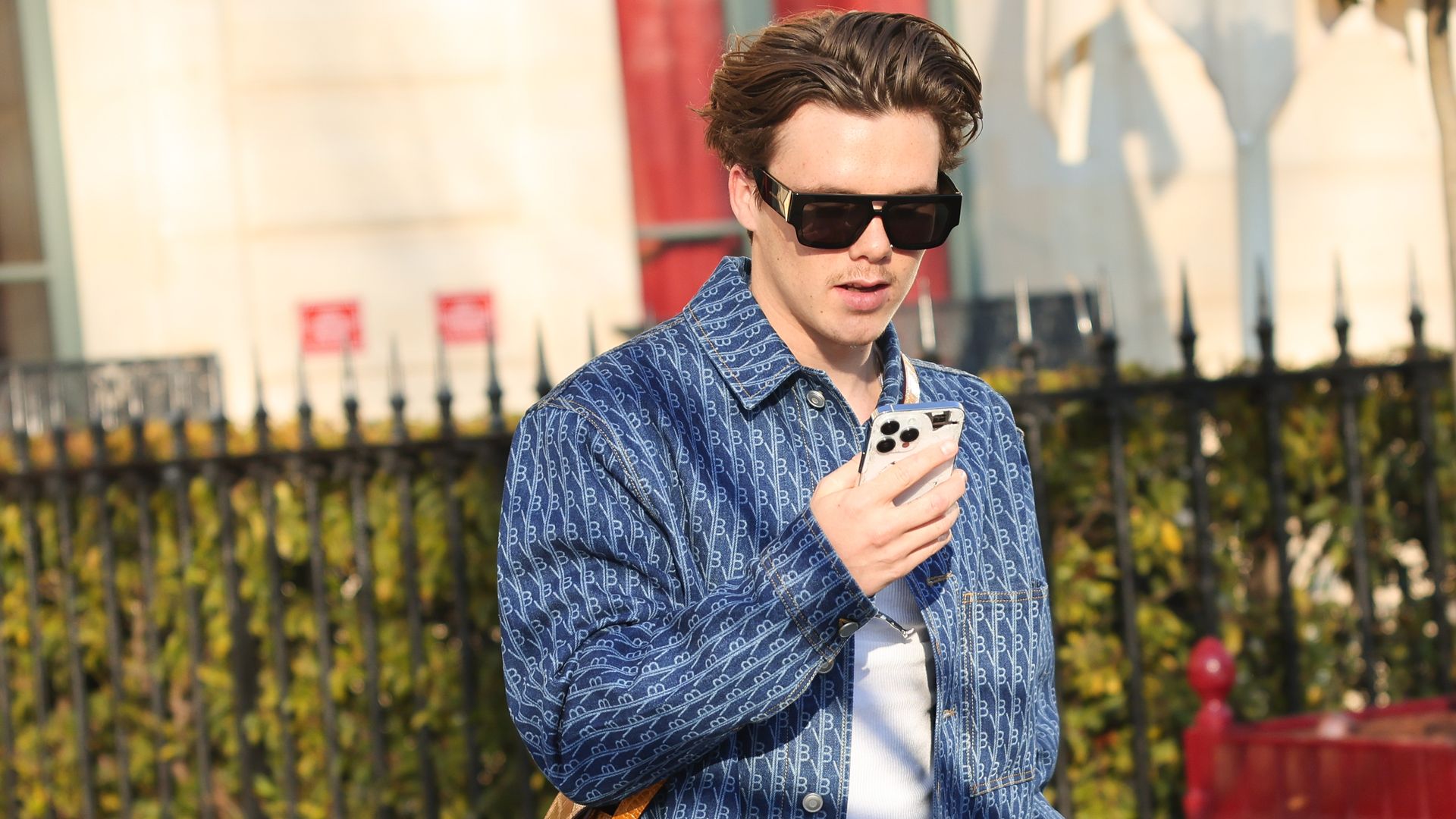 Cruz Beckham is seen during the Paris Fashion Week in double denim