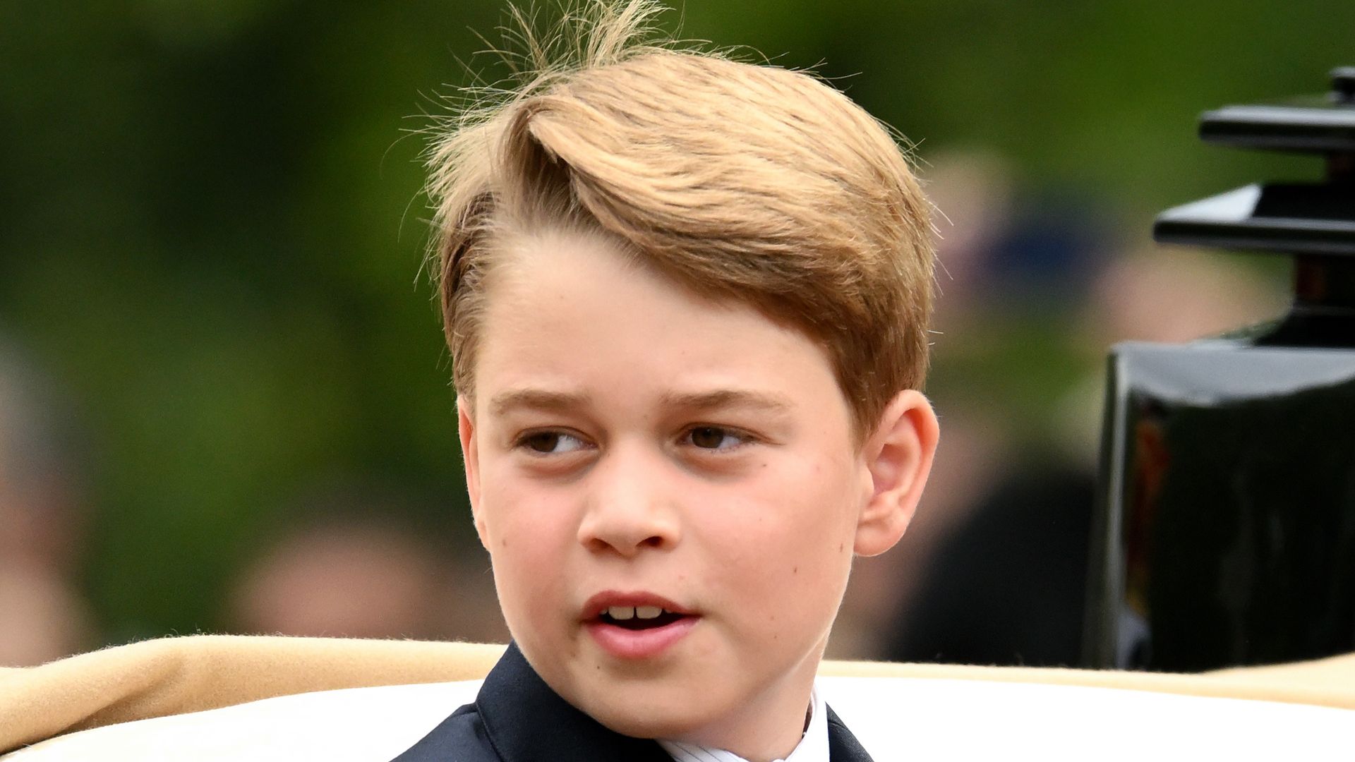 prince george riding in carriage