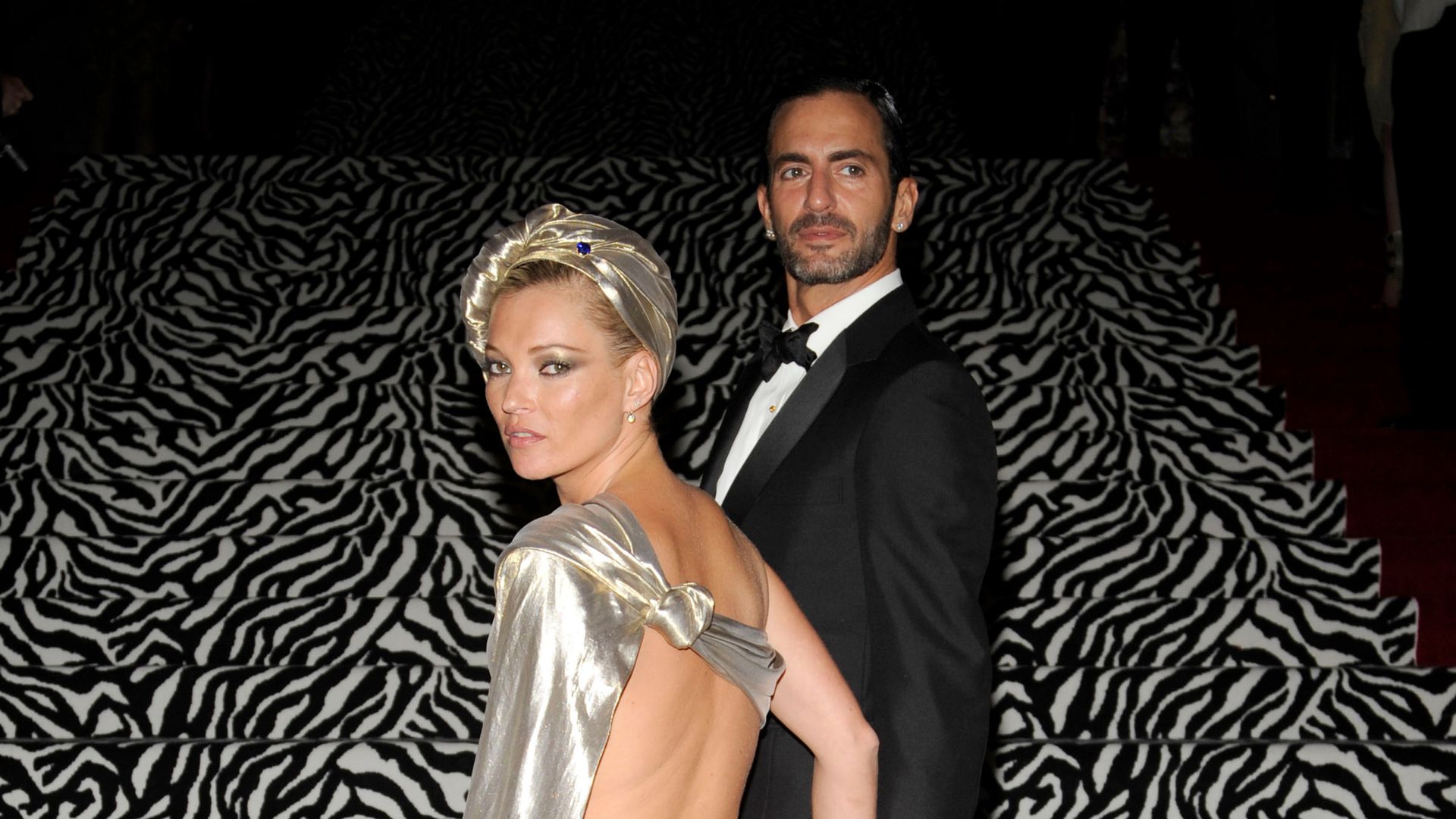 Kate Moss wore a silver backless mini-dress with a turban to the 2009 Met Gala, serving high-glam disco diva energy.