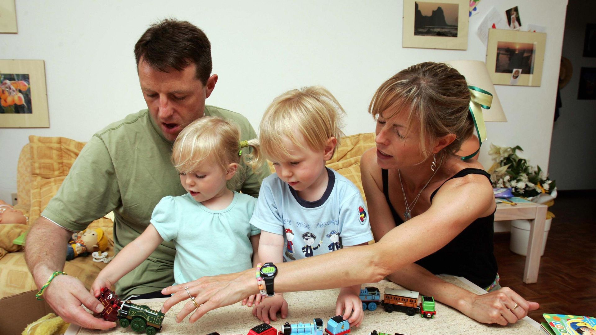 Gerry and Kate McCann playing with their twin children