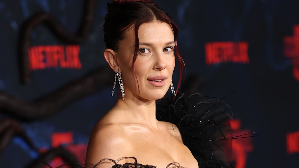 Millie Bobby Brown with fiery red hair at Stay Plush lip oil launch