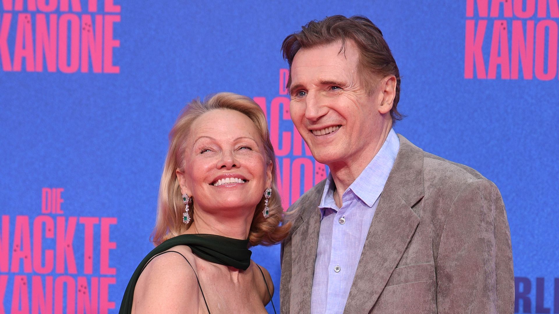 US actress Pamela Anderson and british-irish actor Liam Neeson attend the Berlin premiere of the movie "The Naked Gun" at UCI Luxe East Side Gallery on July 24, 2025 in Berlin, Germany.