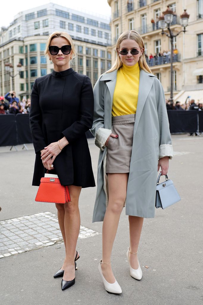 Ava and Reese posing on Paris street