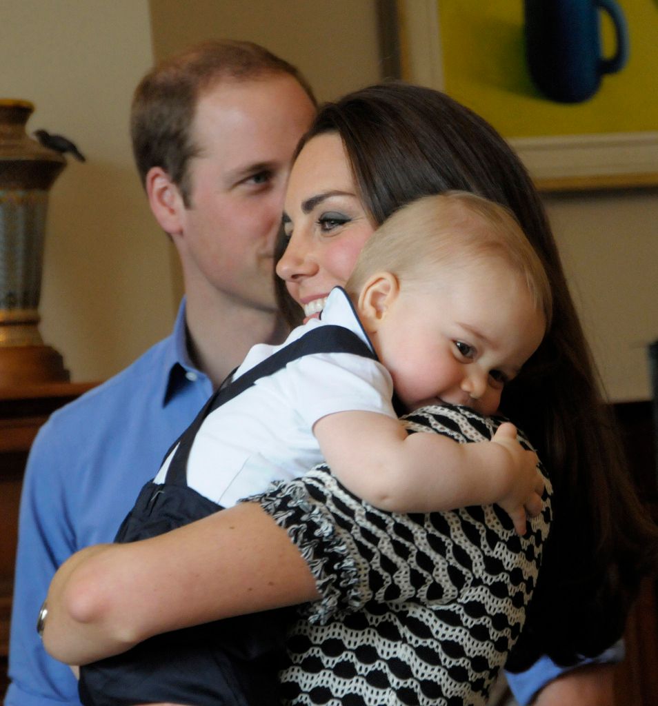 Prince George cuddling Kate's shoulder