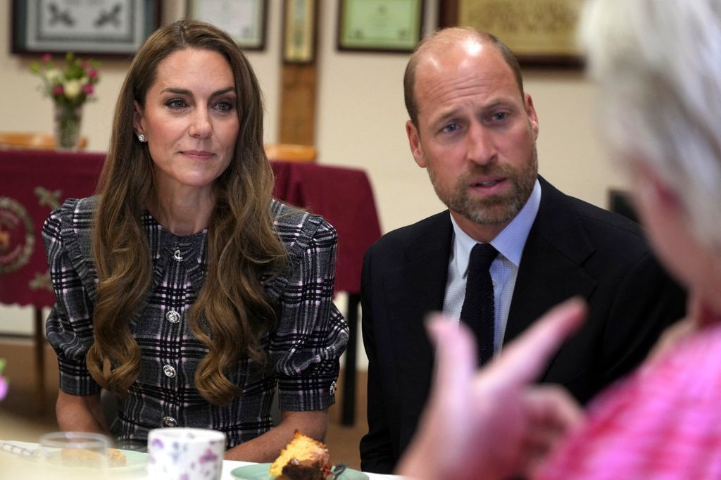 close-up of man and woman sitting at table