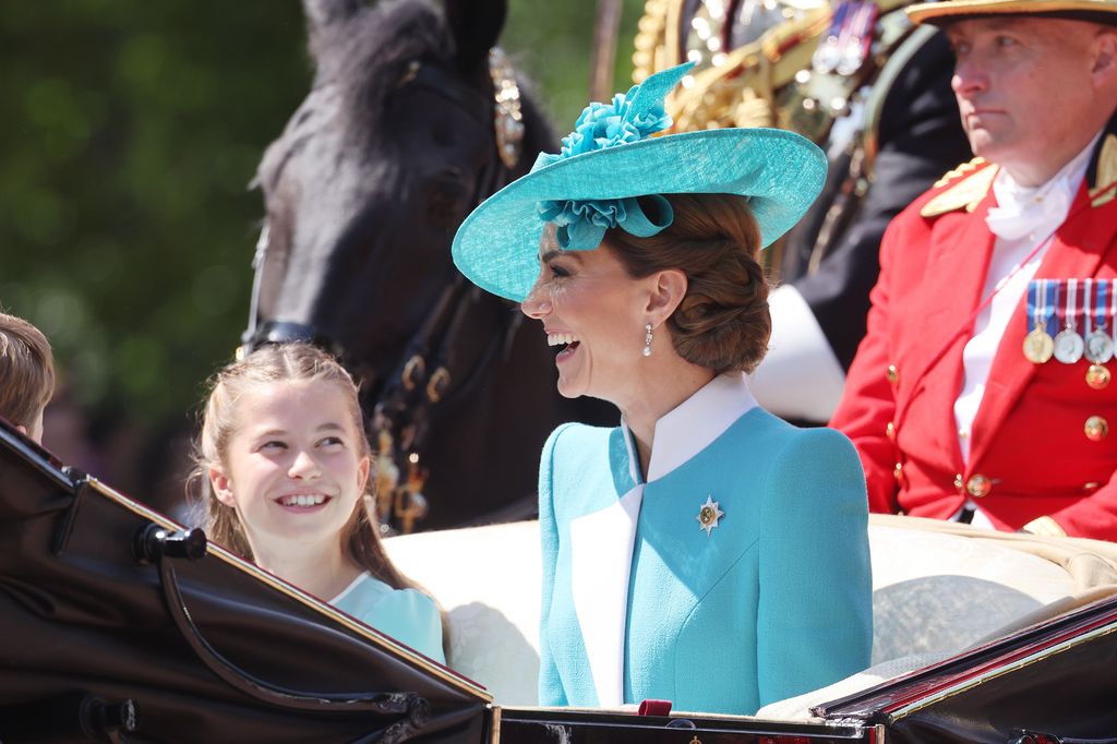 Princess Charlotte proudly looks on at mum Catherine