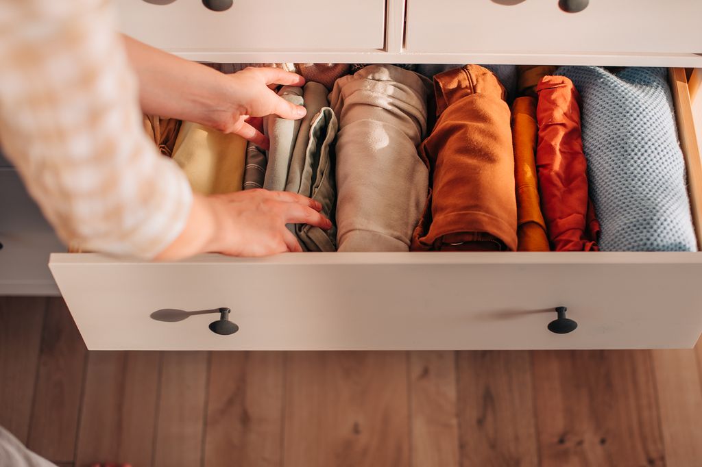 chest of drawers with hand clothes