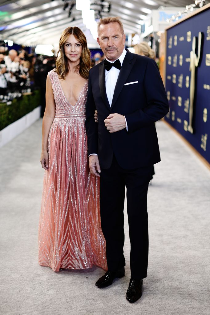 Christine Baumgartner and Kevin Costner attend the 28th Screen Actors Guild Awards at Barker Hangar on February 27, 2022