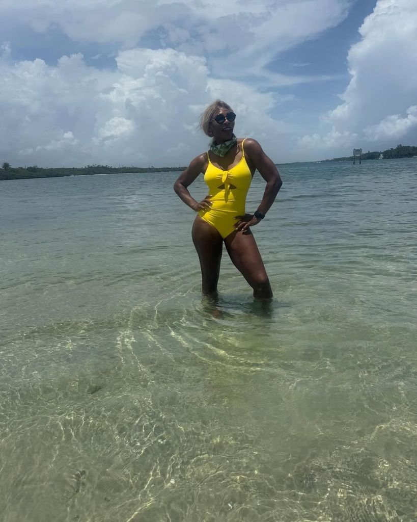 Serena Williams yellow bikini posing in ocean