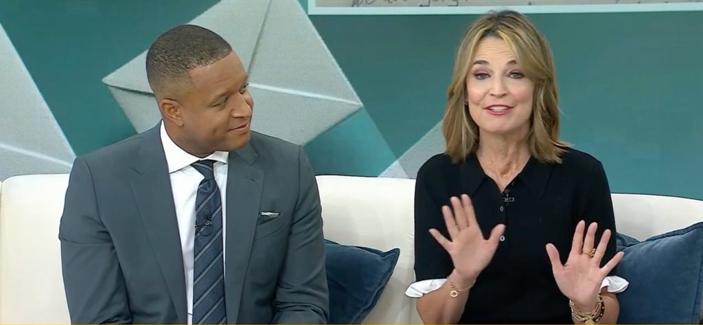 Savannah Guthrie wearing black blouse next to Craig Melvin in gray suit on TODAY