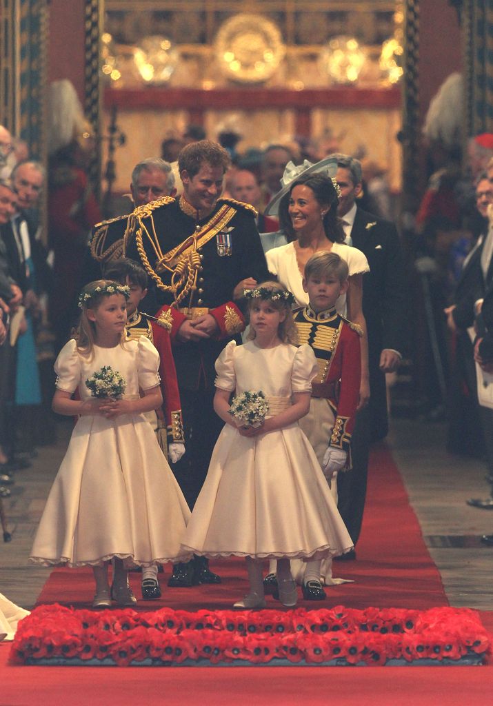 Prince Harry of Wales and maid of honour Pippa Middleton share a joke following the marriage of Prince William and Kate Middleton