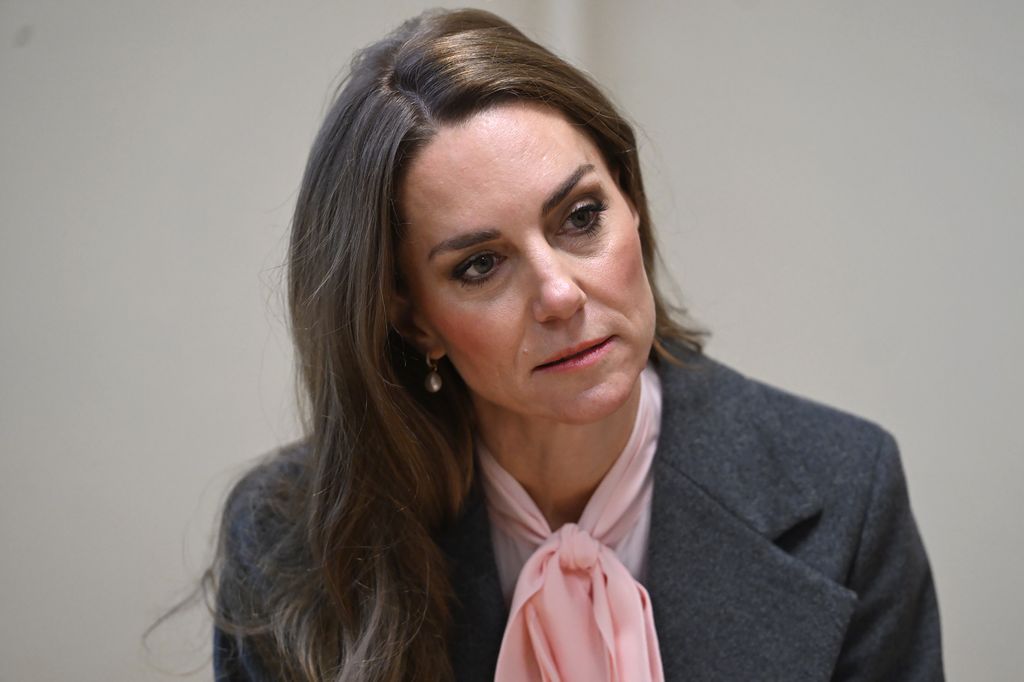Kate Middleton wearing grey coat and pink blouse