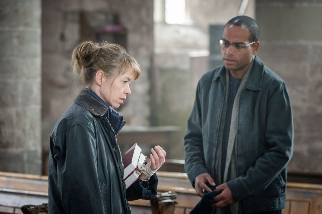 female reverend in church with man