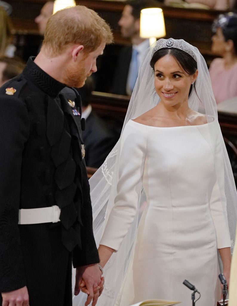 Meghan smiling at Harry at the altar