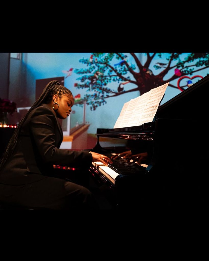 Mercy played piano for the crowd at her mother's event