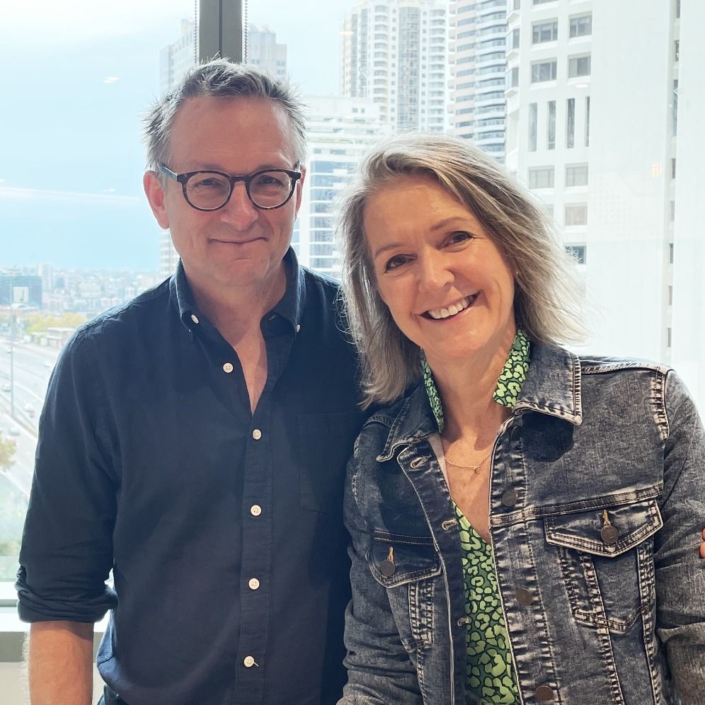 michael mosley standing by high window with wife