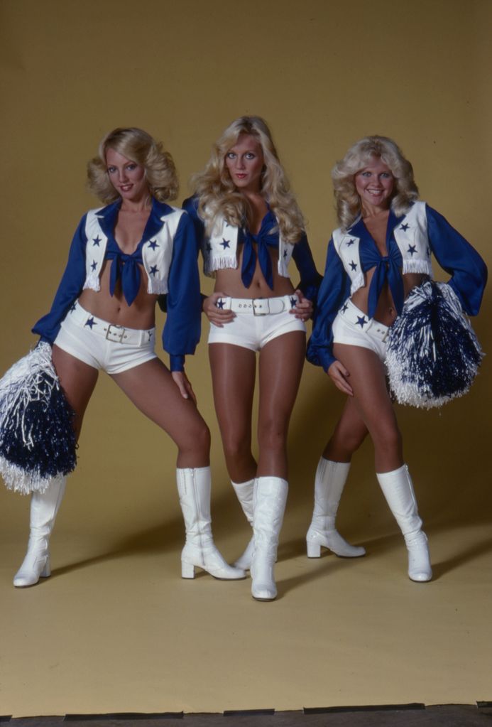 Dallas Cowboys Cheerleaders performing in iconic blue and white uniforms