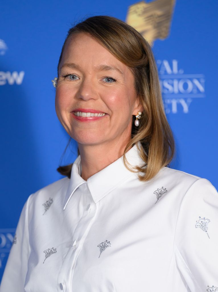 anna maxwell martin smiling in white shirt dress 