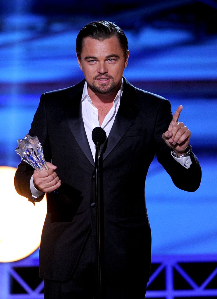 SANTA MONICA, CA - JANUARY 16: Actor Leonardo DiCaprio accepts the award for Best Actor in a Comedy for "The Wolf of Wall Street" onstage during the 19th Annual Critics' Choice Movie Awards at Barker Hangar on January 16, 2014 in Santa Monica, California. (Photo by Kevin Winter/Getty Images)