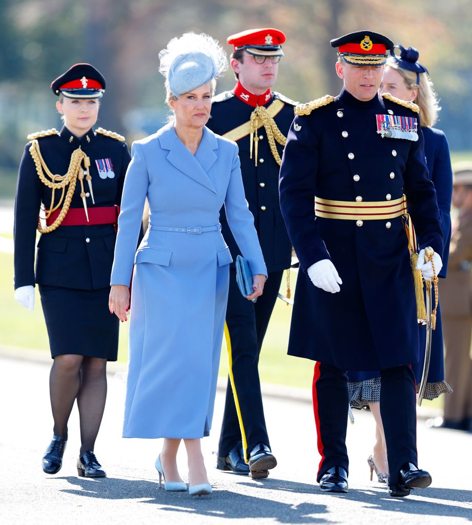 Sophie, Duchess of Edinburgh in blue with men in uniform