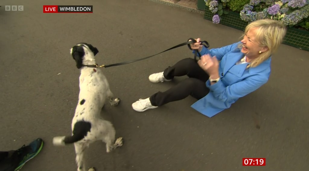 Carol Kirkwood laughing while holding dog lead
