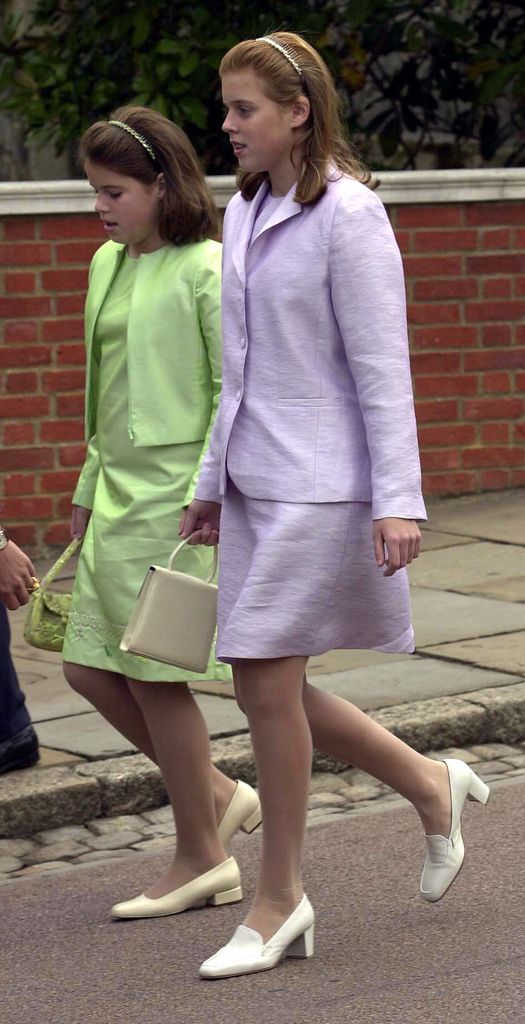 A photo of Eugenie and Beatrice wearing matching suits 
