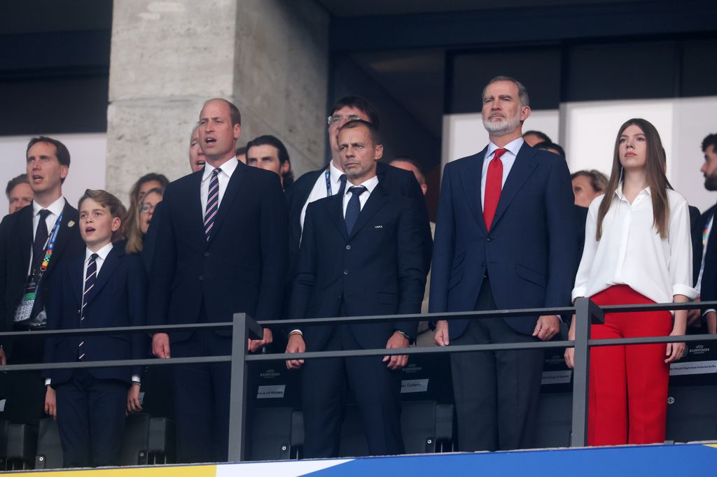 Prince George, Prince William, Prince of Wales and President of The FA sing the national anthem as Aleksander Ceferin, President of UEFA, Felipe VI, King of Spain and Leonor, Princess of Asturias look on prior to the UEFA EURO 2024 final match between Spain and England