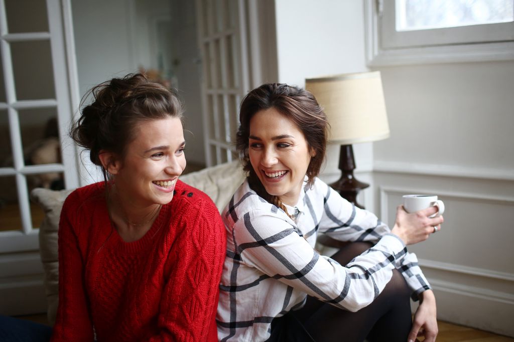 Two friends laughing together