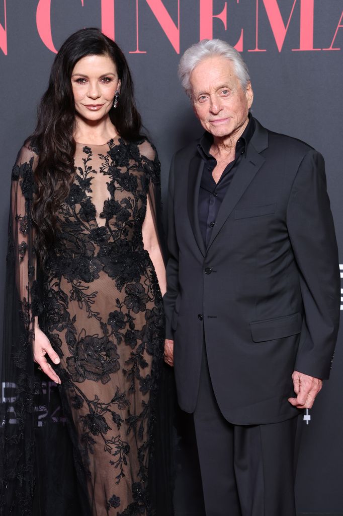 Michael and Catherine look smart in lace gown and suit in red carpet photo