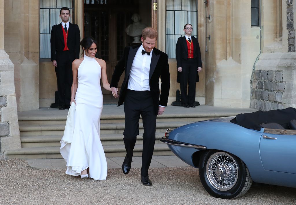 Meghan Markle wears a white halter neck gown at her 2018 with Prince Harry