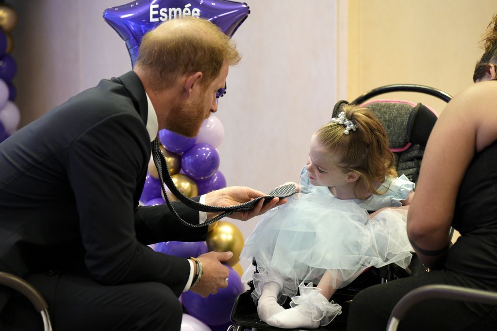 Prince Harry, Duke of Sussex speaks with six-year-old Esmee, recipient of the Inspirational Child 4-6 award