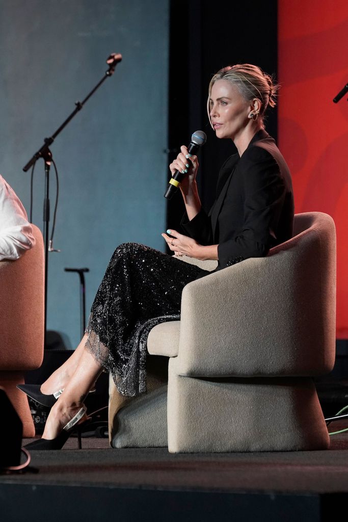 Charlize Theron speaks onstage during Charlize Theron's Africa Outreach Project (CTAOP) Block Party at Universal Studios Backlot on July 13, 2024 in Universal City, California.