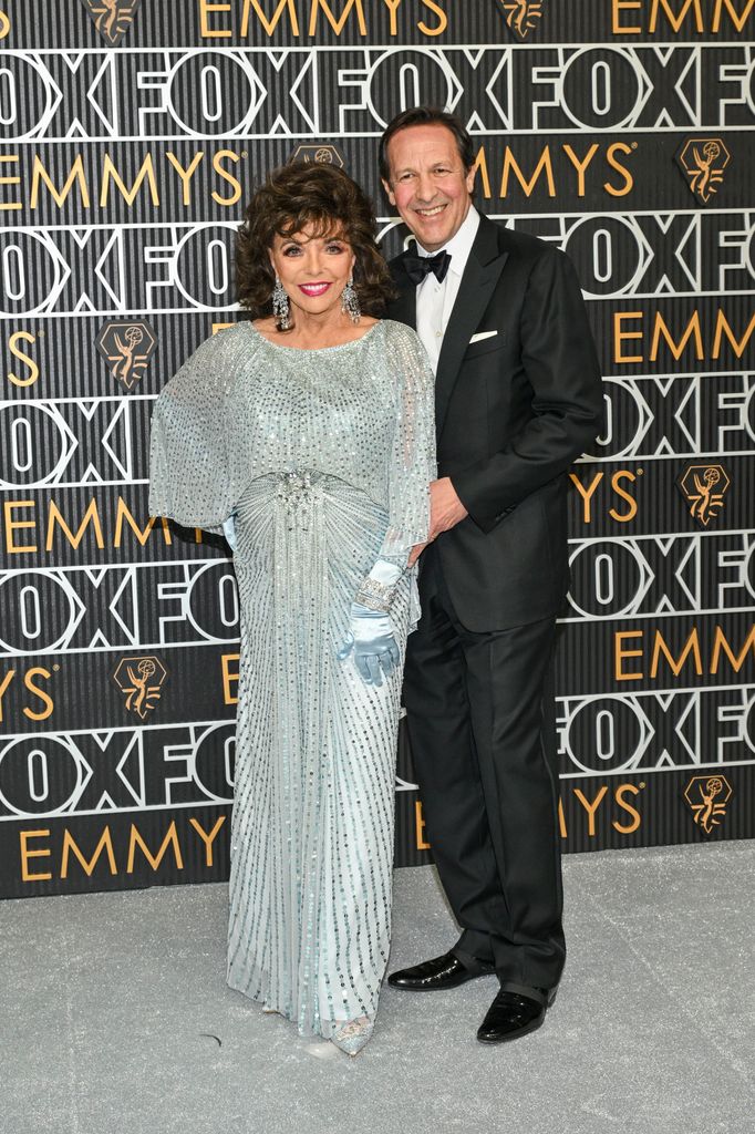 couple posing at awards ceremony 