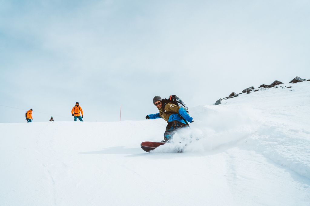 Snowboarder hitting the slopes wearing Cirkle Supply Co.